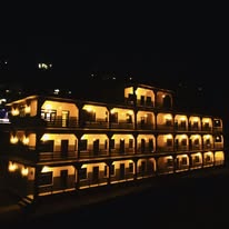 Hotel Trekker's Sanctuary lit up at night